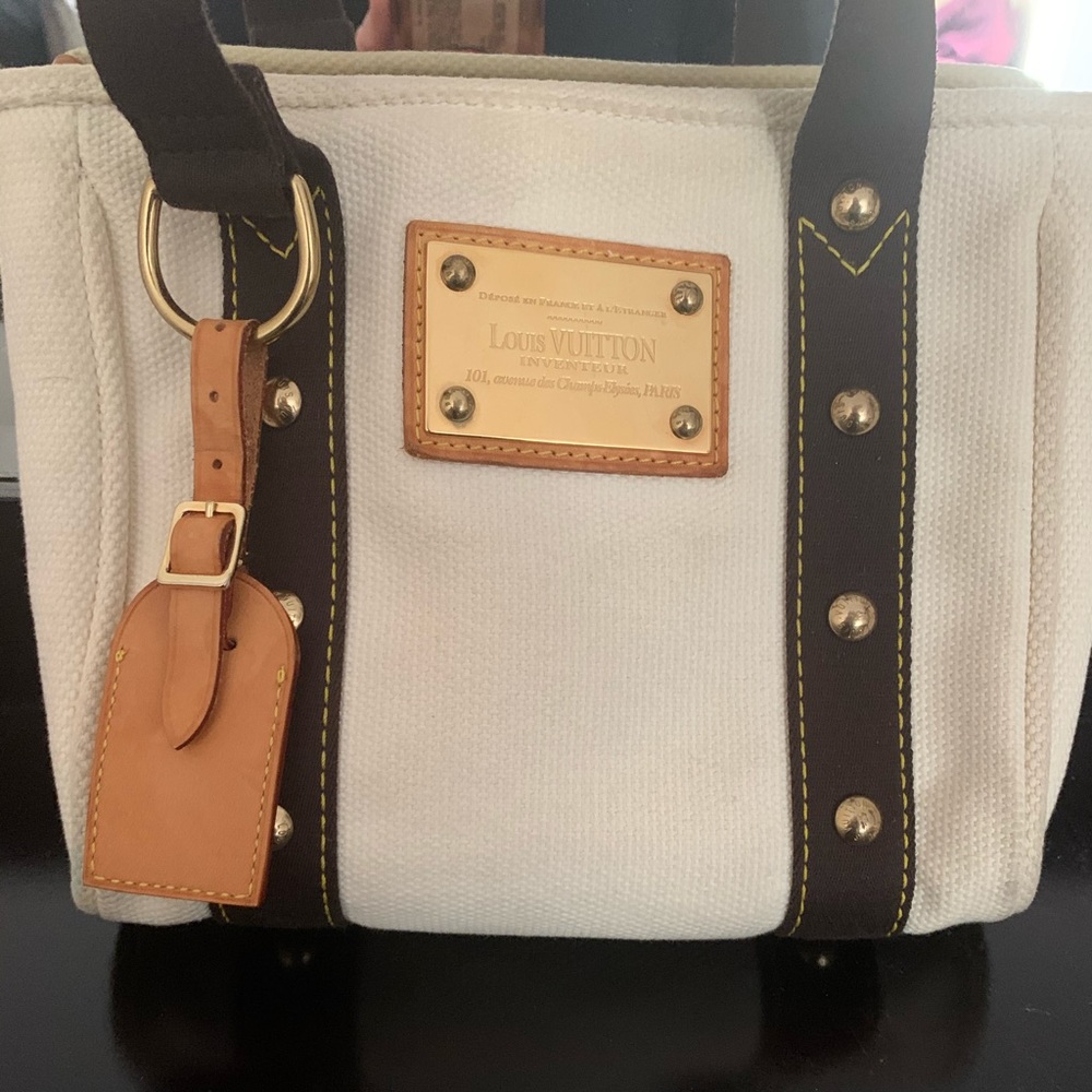 Authentic Louis Vuitton Inventeur Antigua canvas